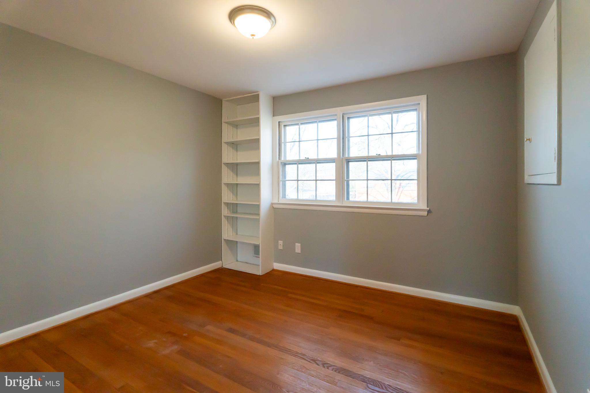 2215 Solmar Drive Silver Spring, MD 20904 - Photo 25 of 34 an empty room with wooden floor and windows