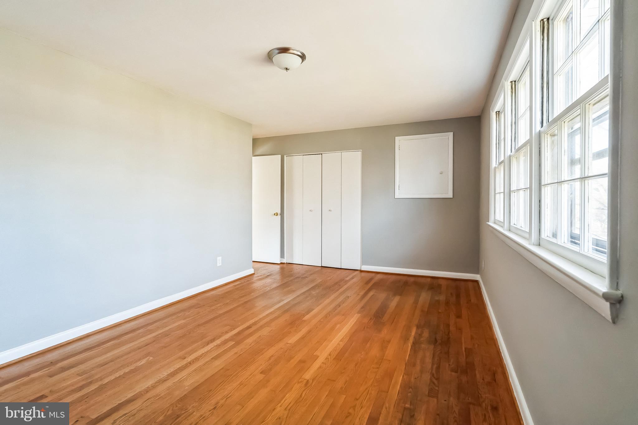 2215 Solmar Drive Silver Spring, MD 20904 - Photo 26 of 34 a view of an empty room with wooden floor and a window