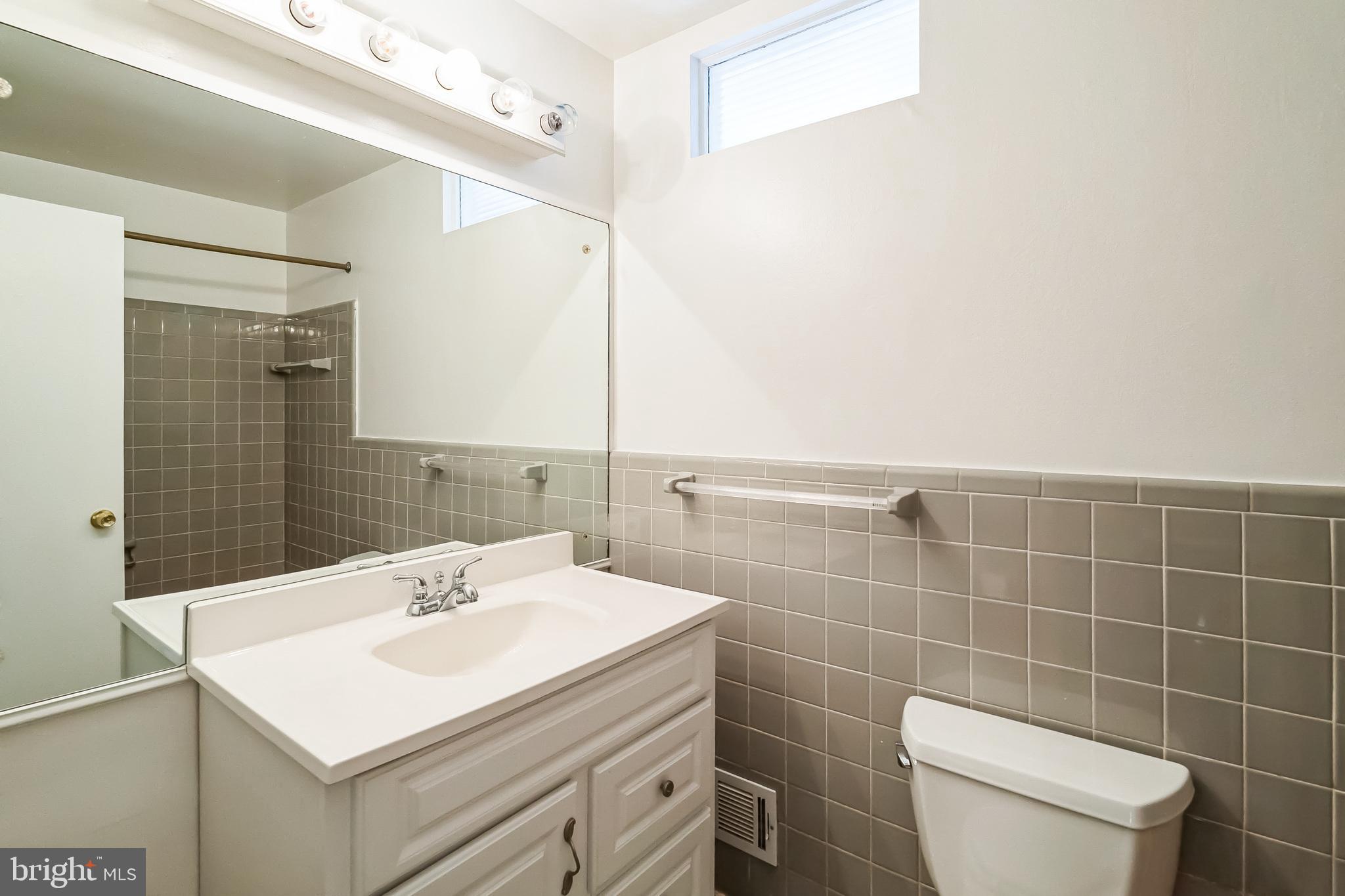 2215 Solmar Drive Silver Spring, MD 20904 - Photo 27 of 34 a bathroom with a sink toilet and mirror