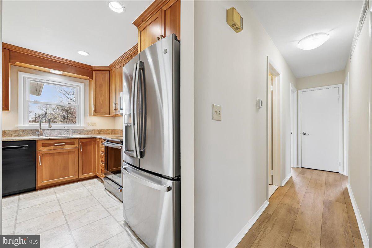 11924 Fernshire Road Gaithersburg, MD 20878 - Photo 12 of 74 Modern kitchen meets inviting hallway.