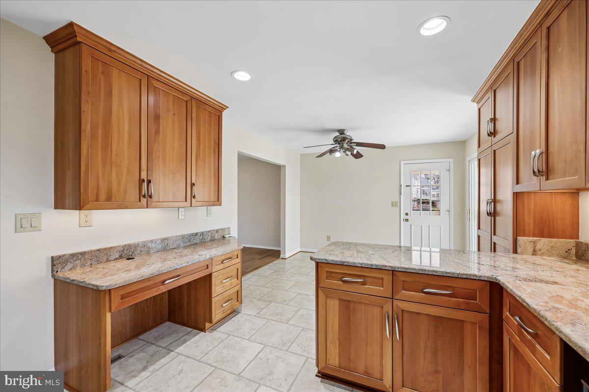 11924 Fernshire Road Gaithersburg, MD 20878 - Photo 13 of 74 a bathroom with a granite countertop sink and a bathtub