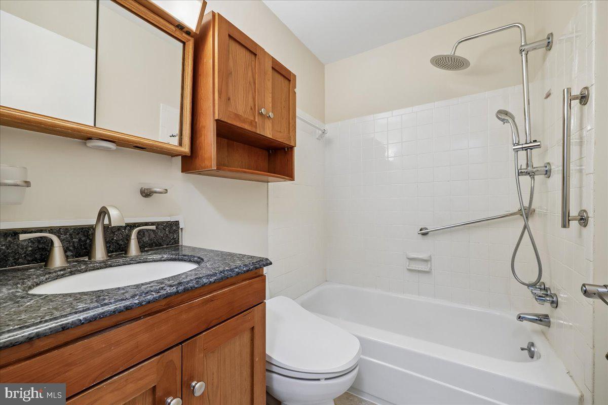11924 Fernshire Road Gaithersburg, MD 20878 - Photo 24 of 74 a bathroom with a granite countertop sink toilet and shower