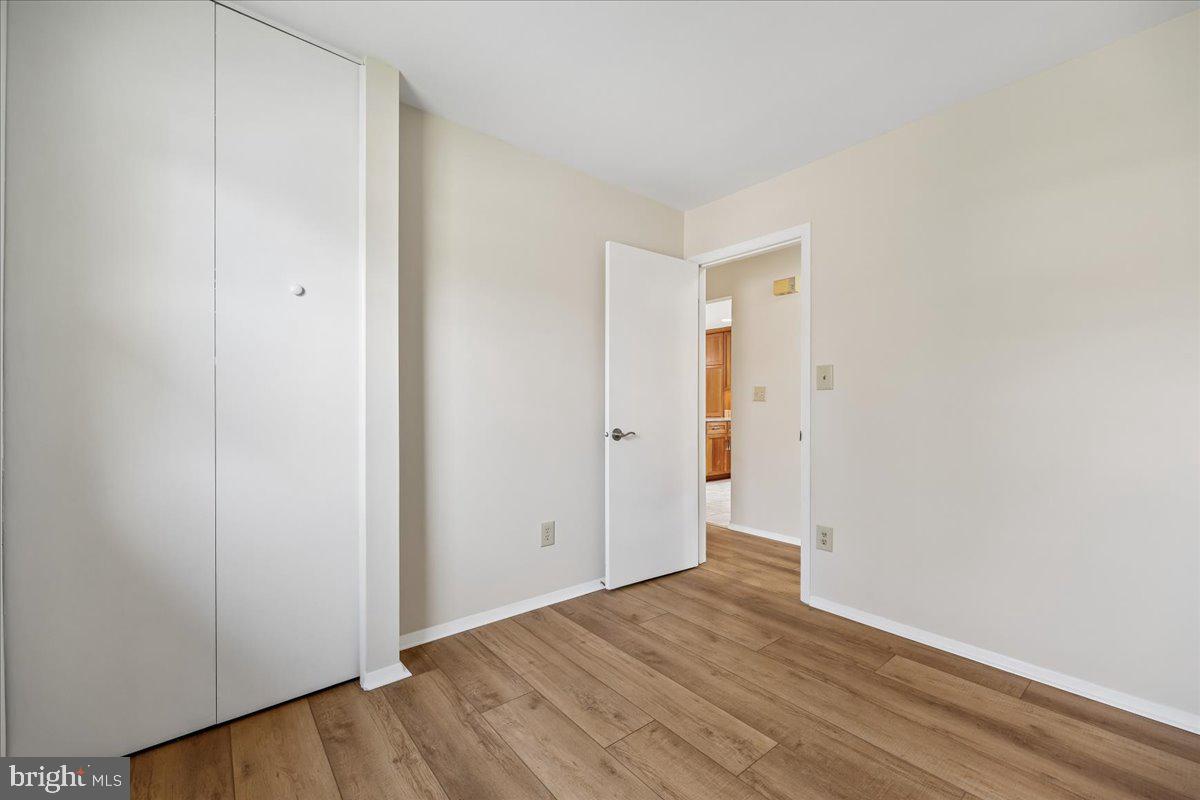 11924 Fernshire Road Gaithersburg, MD 20878 - Photo 25 of 74 a view of an empty room with wooden floor