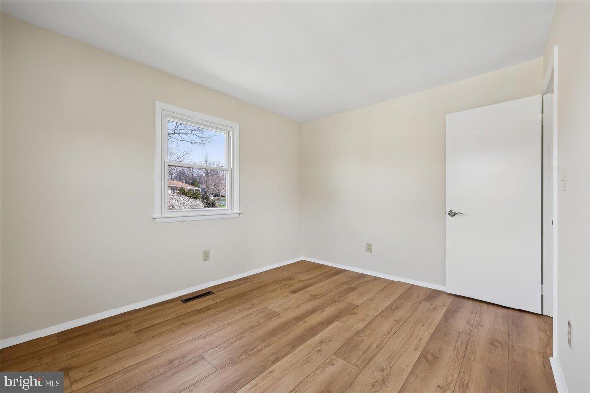 11924 Fernshire Road Gaithersburg, MD 20878 - Photo 30 of 74 a view of empty room with wooden floor