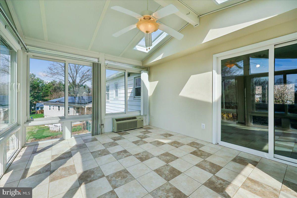 11924 Fernshire Road Gaithersburg, MD 20878 - Photo 36 of 74 a bedroom with a bed and a large window