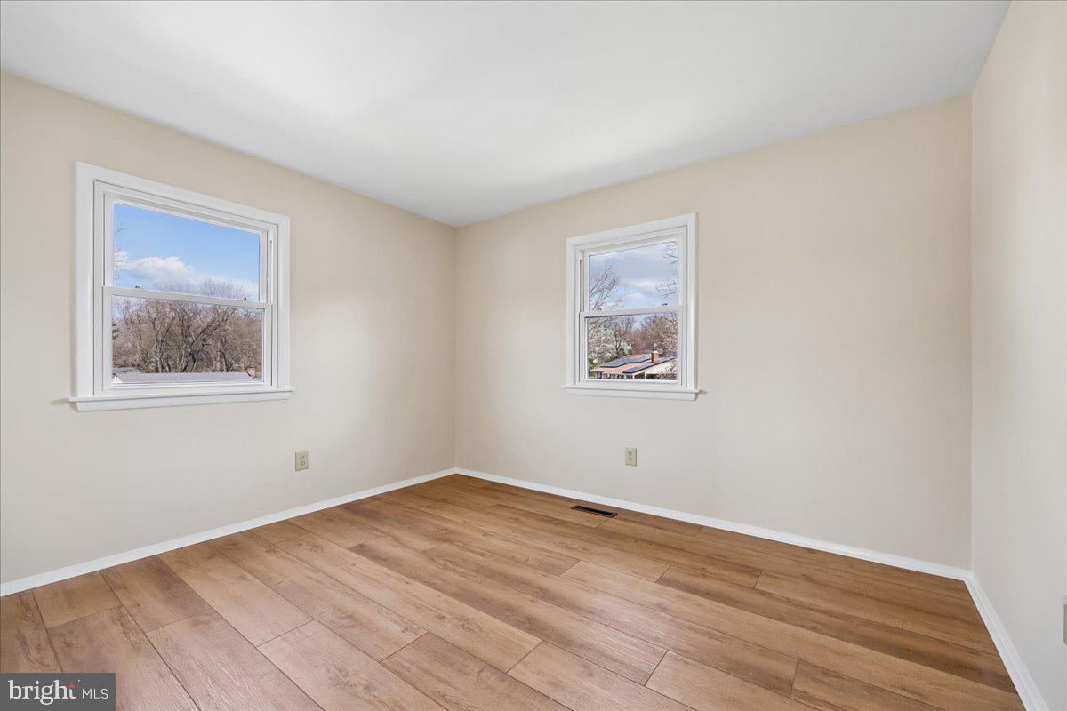 11924 Fernshire Road Gaithersburg, MD 20878 - Photo 42 of 74 a view of empty room with wooden floor
