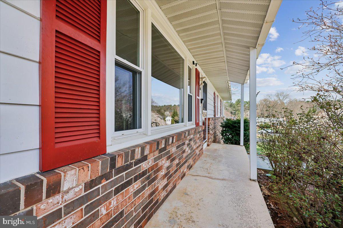 11924 Fernshire Road Gaithersburg, MD 20878 - Photo 49 of 74 Charming porch with vibrant shutters.