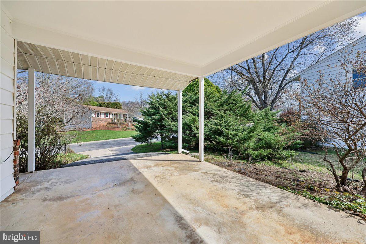 11924 Fernshire Road Gaithersburg, MD 20878 - Photo 70 of 74 Charming porch with lush greenery.