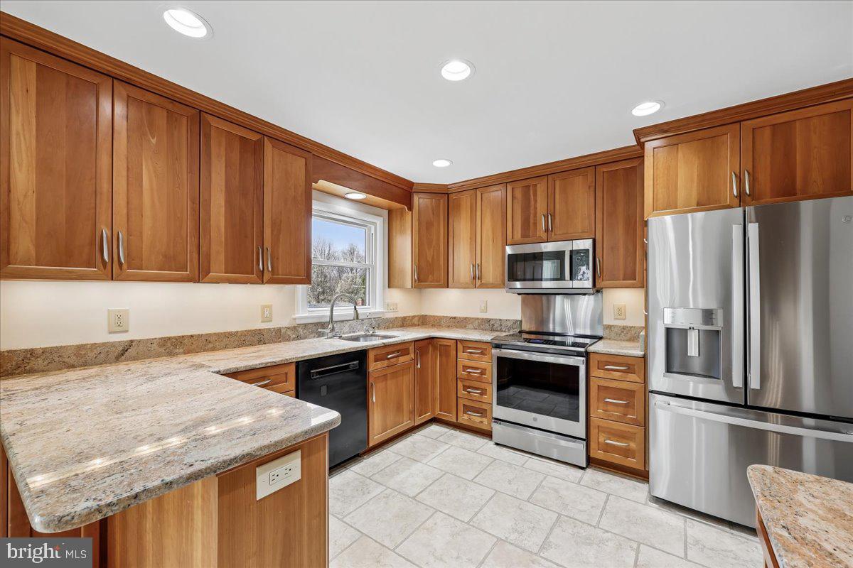 11924 Fernshire Road Gaithersburg, MD 20878 - Photo 7 of 74 Modern kitchen with warm wood tones.
