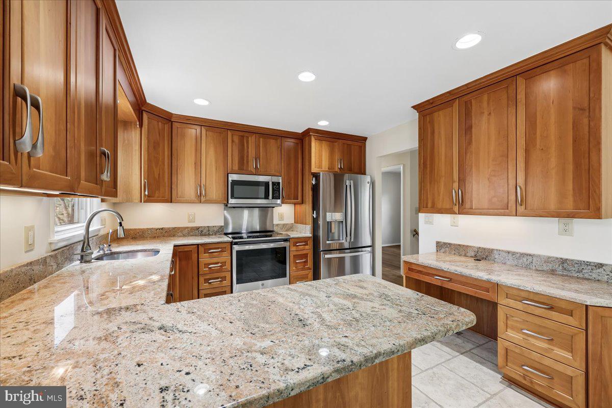 11924 Fernshire Road Gaithersburg, MD 20878 - Photo 8 of 74 Modern kitchen with rich wood accents.