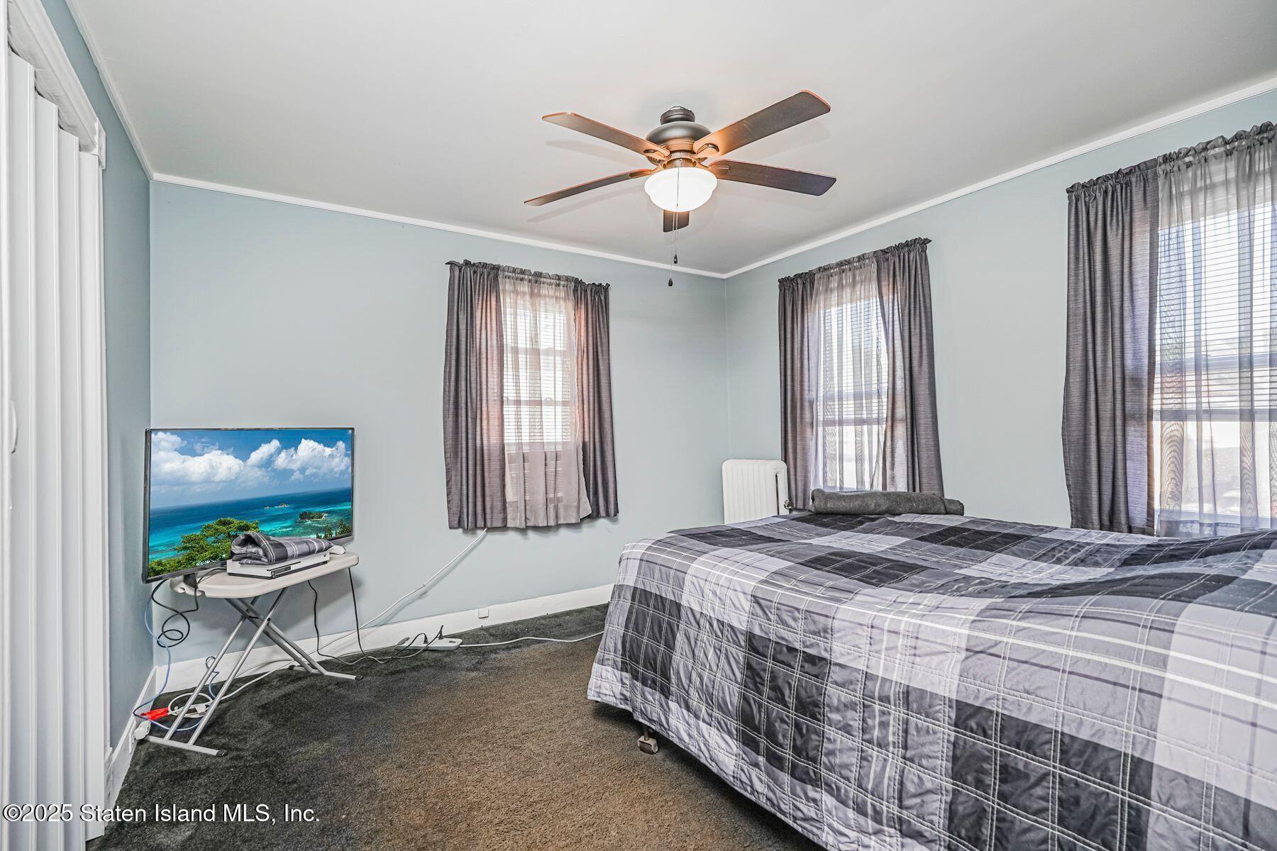 5300 Amboy Road Staten Island, NY 10312 - Photo 17 of 32 a bedroom with a bed and a window