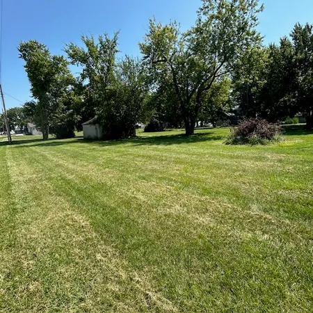 a view of outdoor space with deck and trees