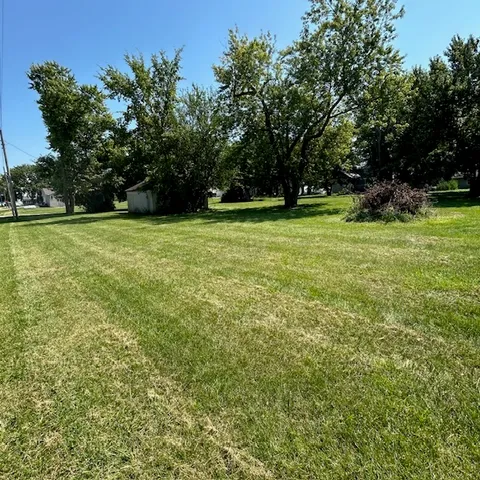 a view of outdoor space with deck and trees