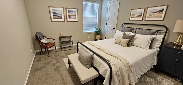 a bedroom with a bed and a chair