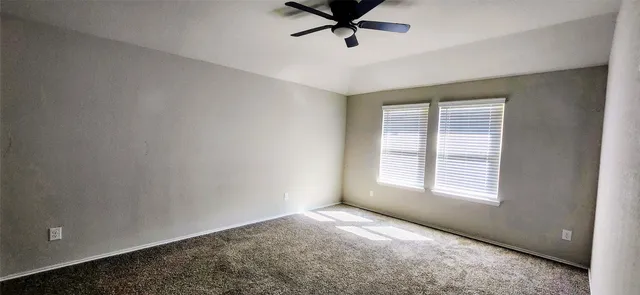 a view of a room that has a window in it