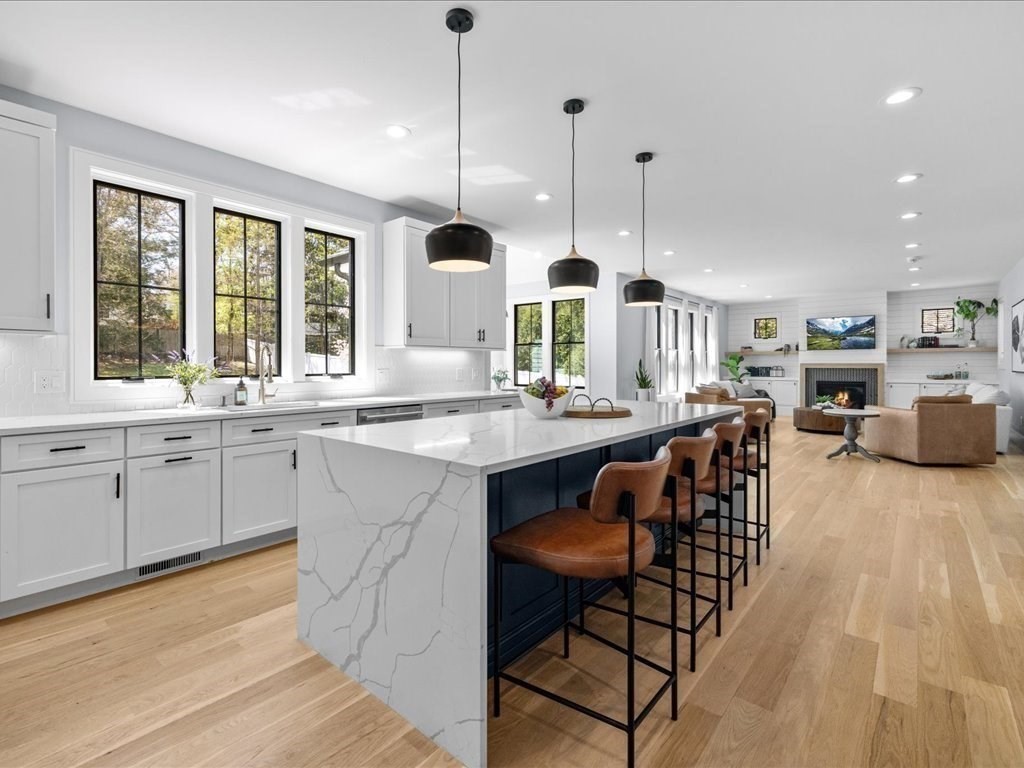 90 Norfolk Street Needham, MA 02492 - Photo 11 of 42 a kitchen with stainless steel appliances granite countertop a sink a stove and a wooden floors