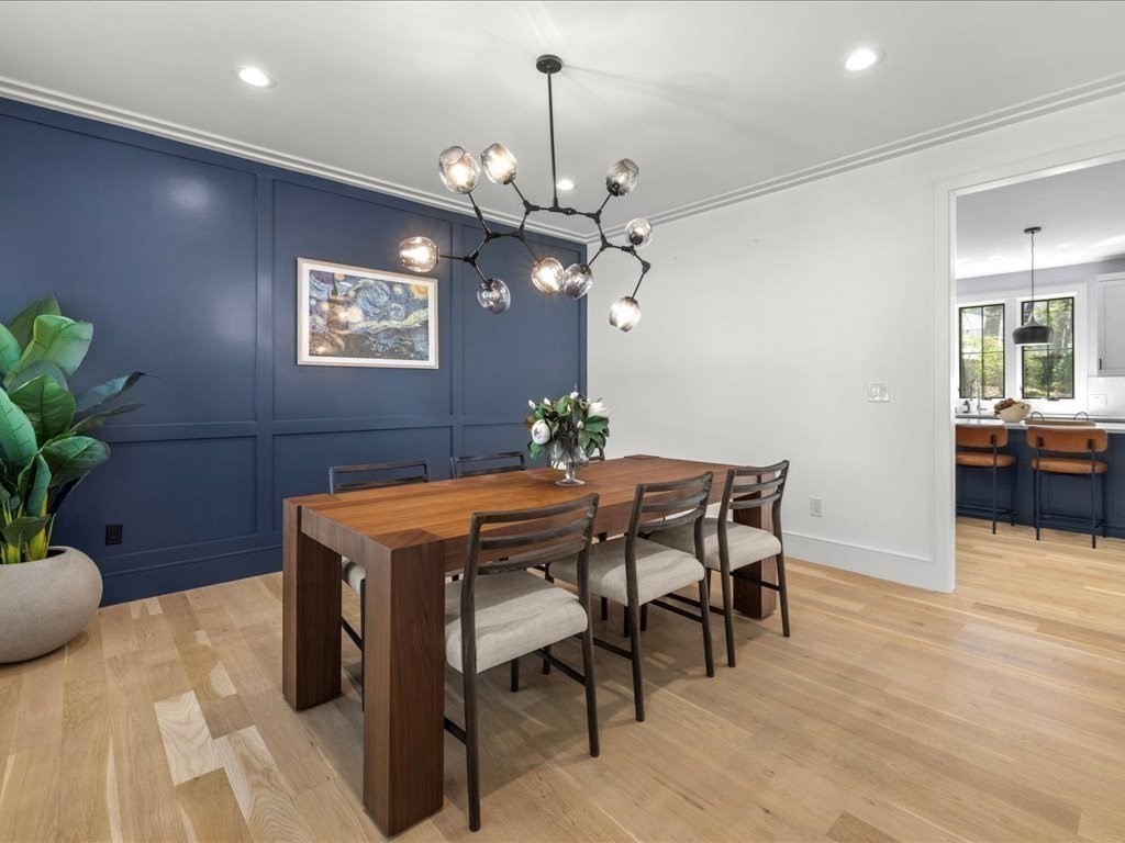 90 Norfolk Street Needham, MA 02492 - Photo 16 of 42 a dining room with furniture and chandelier