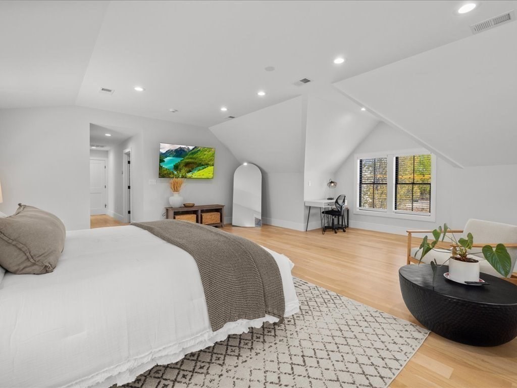 90 Norfolk Street Needham, MA 02492 - Photo 25 of 42 a bedroom with a bed and window