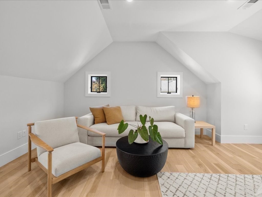 90 Norfolk Street Needham, MA 02492 - Photo 27 of 42 a living room with furniture and a couch