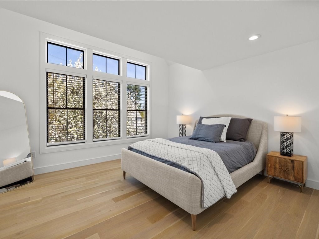 90 Norfolk Street Needham, MA 02492 - Photo 29 of 42 a spacious bedroom with a bed and a window