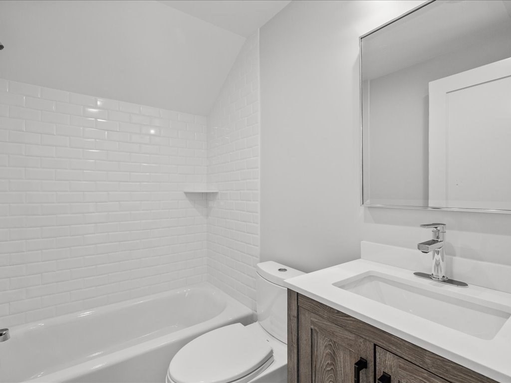 90 Norfolk Street Needham, MA 02492 - Photo 35 of 42 a bathroom with a sink toilet vanity and bathtub