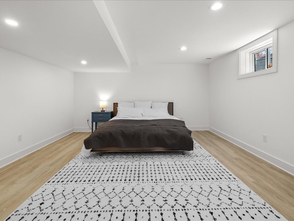 90 Norfolk Street Needham, MA 02492 - Photo 37 of 42 a bedroom with a bed and a window