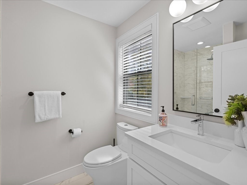90 Norfolk Street Needham, MA 02492 - Photo 38 of 42 a bathroom with a sink toilet and shower