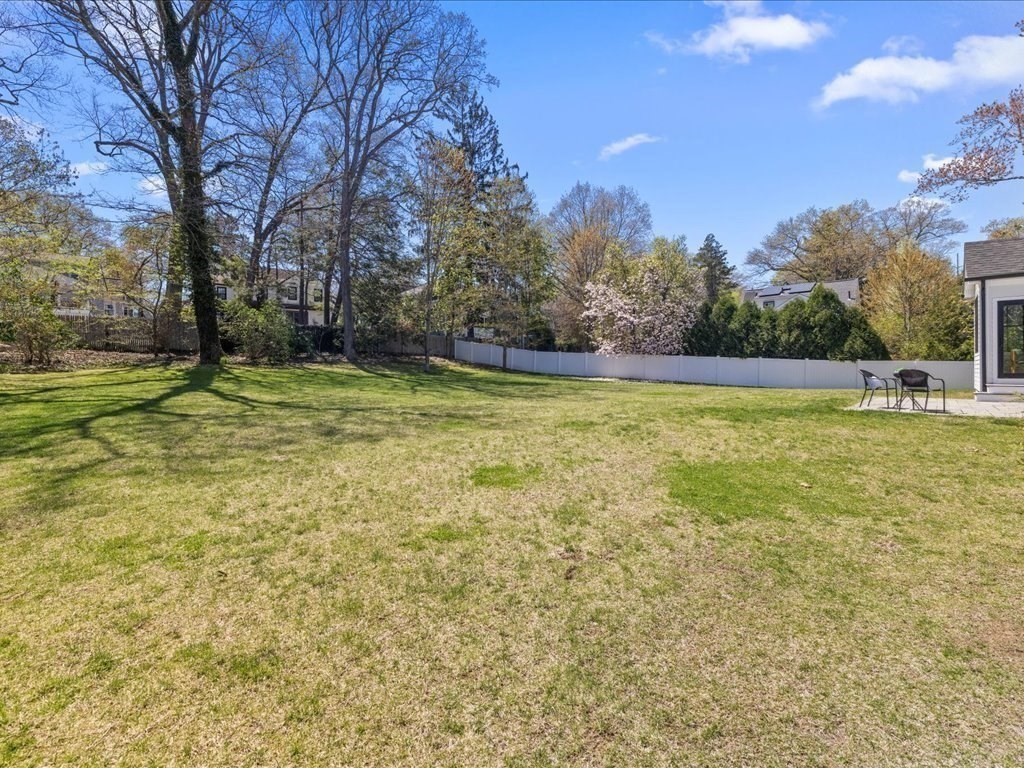 90 Norfolk Street Needham, MA 02492 - Photo 39 of 42 a swimming pool with trees in the background