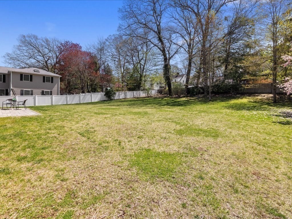 90 Norfolk Street Needham, MA 02492 - Photo 40 of 42 a view of a house with a yard