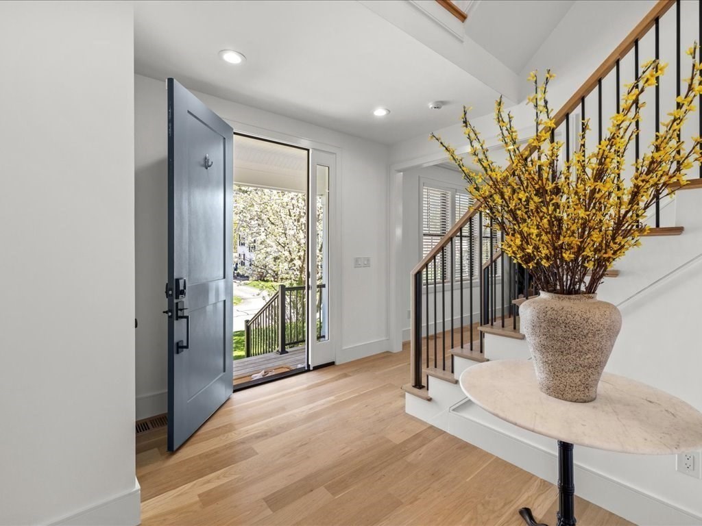 90 Norfolk Street Needham, MA 02492 - Photo 5 of 42 a view of an entryway with wooden floor and door