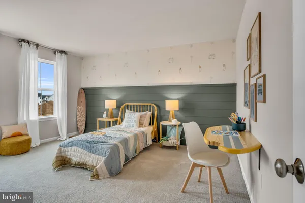 a bedroom with a bed and a couch