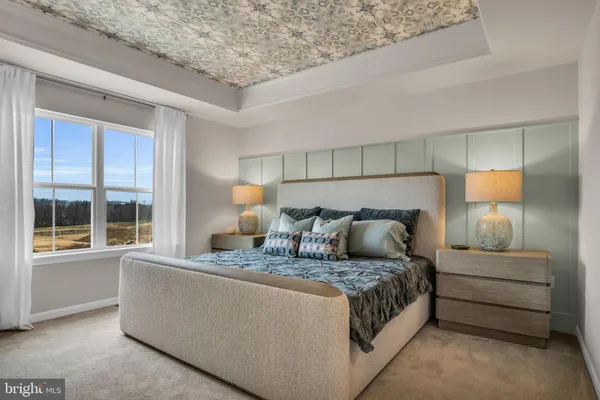 a bedroom with bed and window