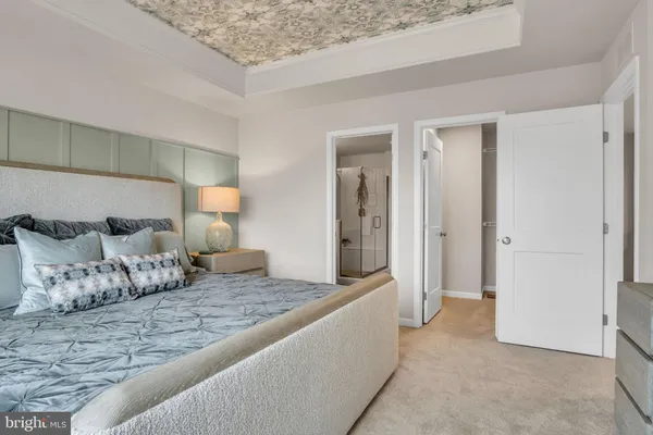 a bedroom with a bed and walk in closet