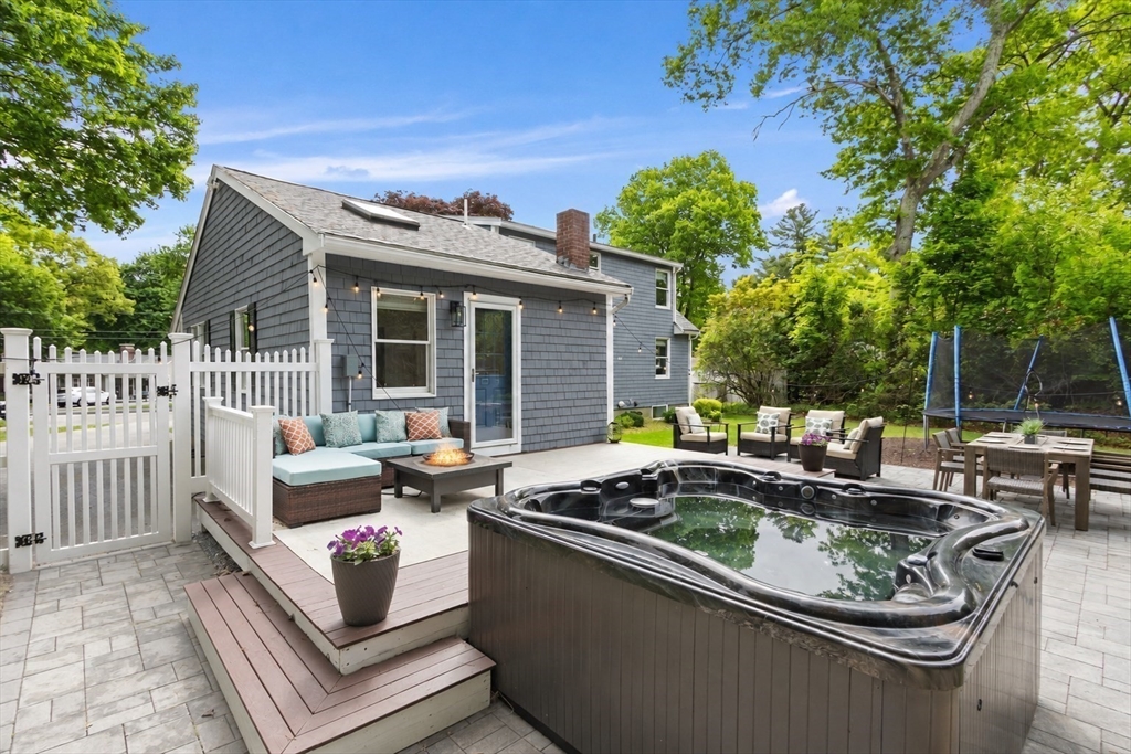 61 Pine Ridge Drive Franklin, MA 02038 - Photo 32 of 41 a view of a patio with couches table and chairs and potted plants