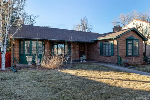 a view of a house with backyard porch and furniture
