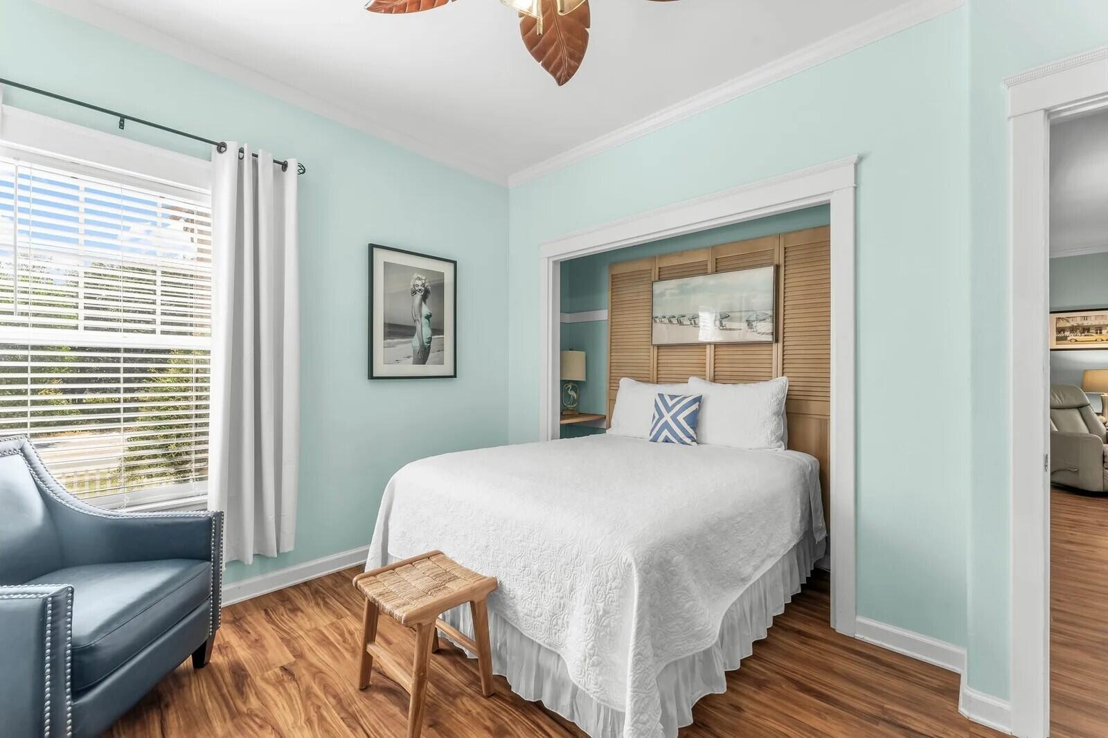 4503 John Avenue Destin, FL 32541 - Photo 16 of 51 a bedroom with a bed and wooden floor