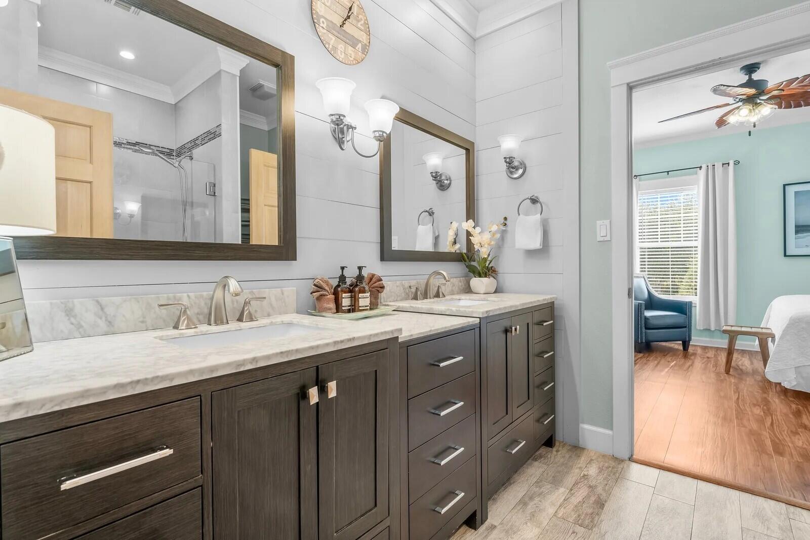 4503 John Avenue Destin, FL 32541 - Photo 18 of 51 a bathroom with a granite countertop sink double vanity and a mirror