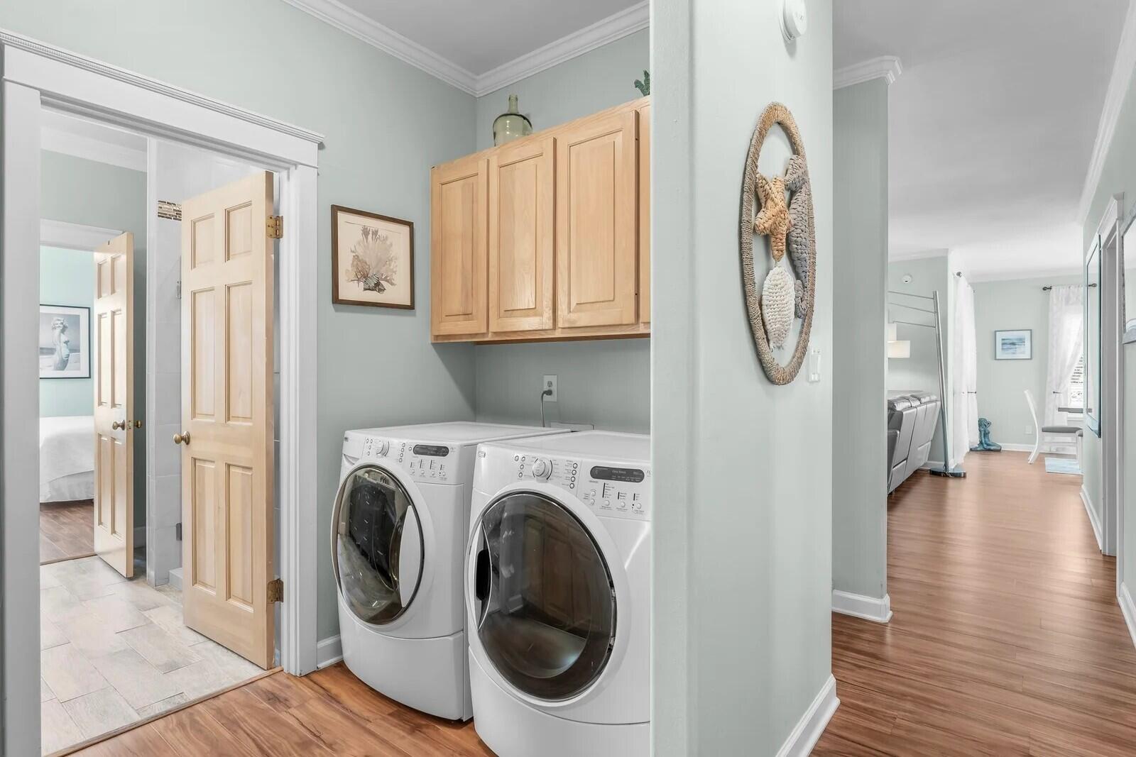 4503 John Avenue Destin, FL 32541 - Photo 20 of 51 a view of a hallway with washer and dryer