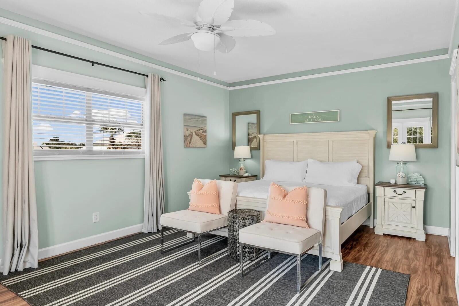 4503 John Avenue Destin, FL 32541 - Photo 26 of 51 a spacious bedroom with a bed and wooden floor