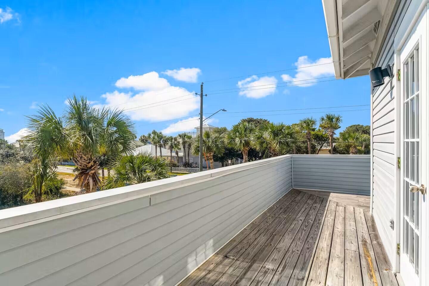 4503 John Avenue Destin, FL 32541 - Photo 30 of 51 a view of balcony with wooden floor and city view