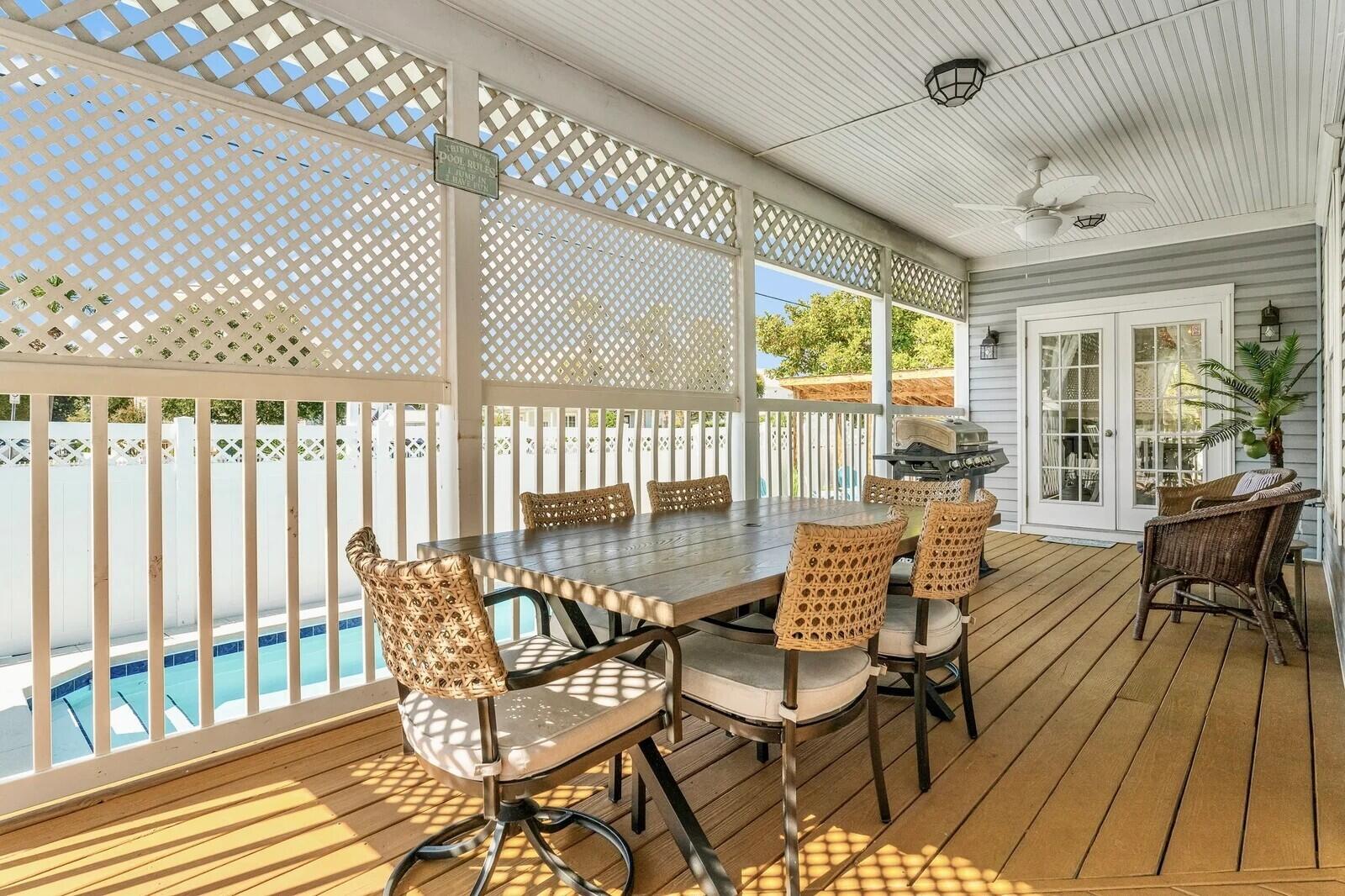 4503 John Avenue Destin, FL 32541 - Photo 34 of 51 a view of a patio with furniture