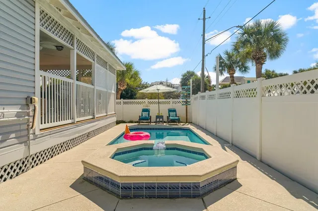 a view of backyard with outdoor seating
