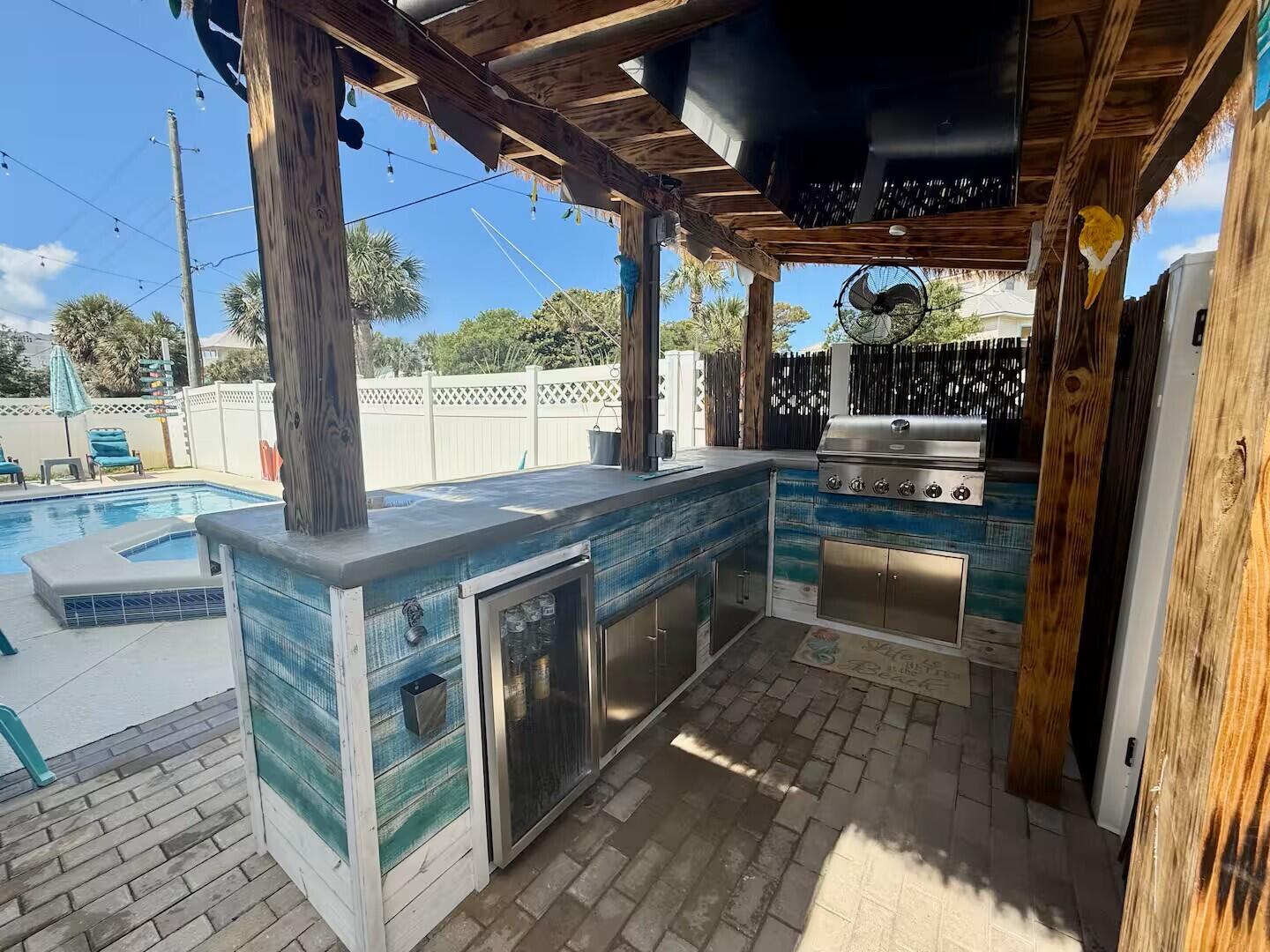 4503 John Avenue Destin, FL 32541 - Photo 40 of 51 a open kitchen with stainless steel appliances granite countertop a stove a sink and a refrigerator