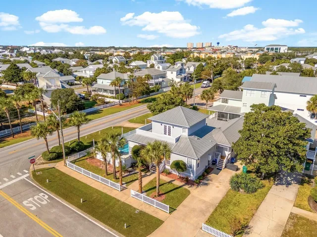 an aerial view of residential building with parking