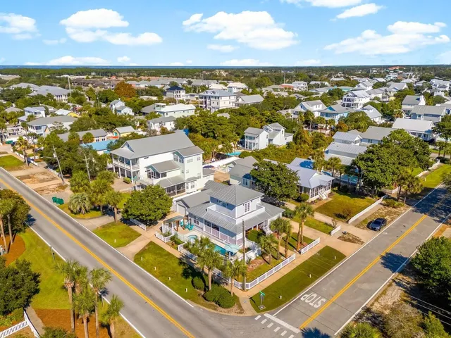 an aerial view of residential houses and outdoor space