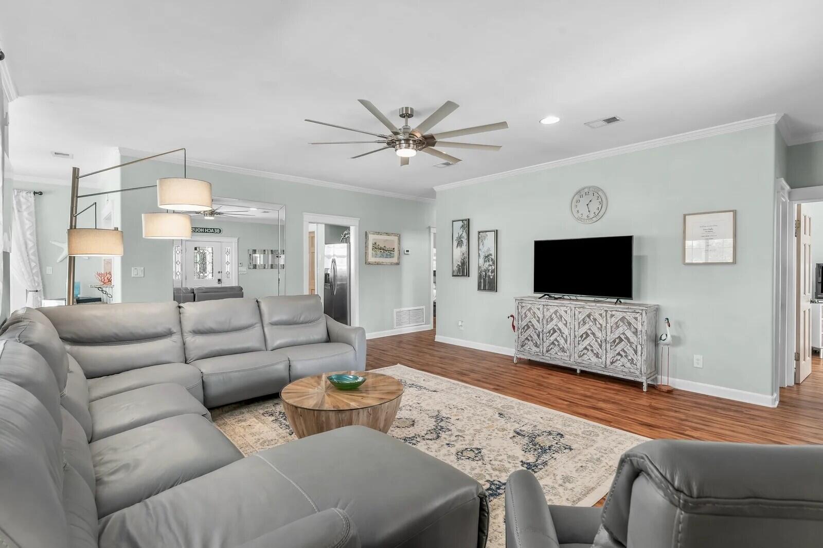 4503 John Avenue Destin, FL 32541 - Photo 6 of 51 a living room with furniture a flat screen tv and a couch