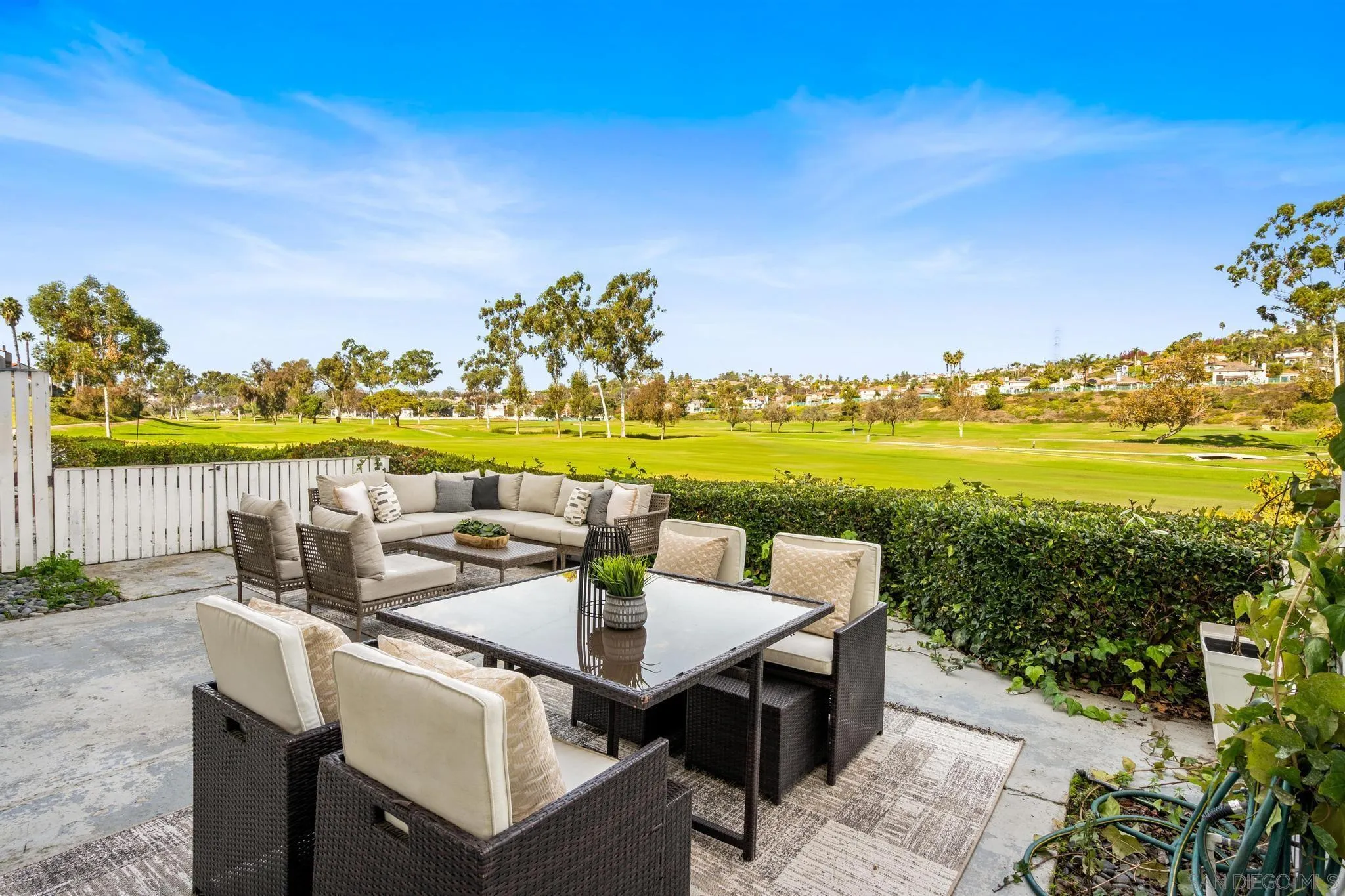 2544 Navarra Drive, Unit 17 Carlsbad, CA 92009 - Photo 21 of 24 a view of an ocean with a table and chairs