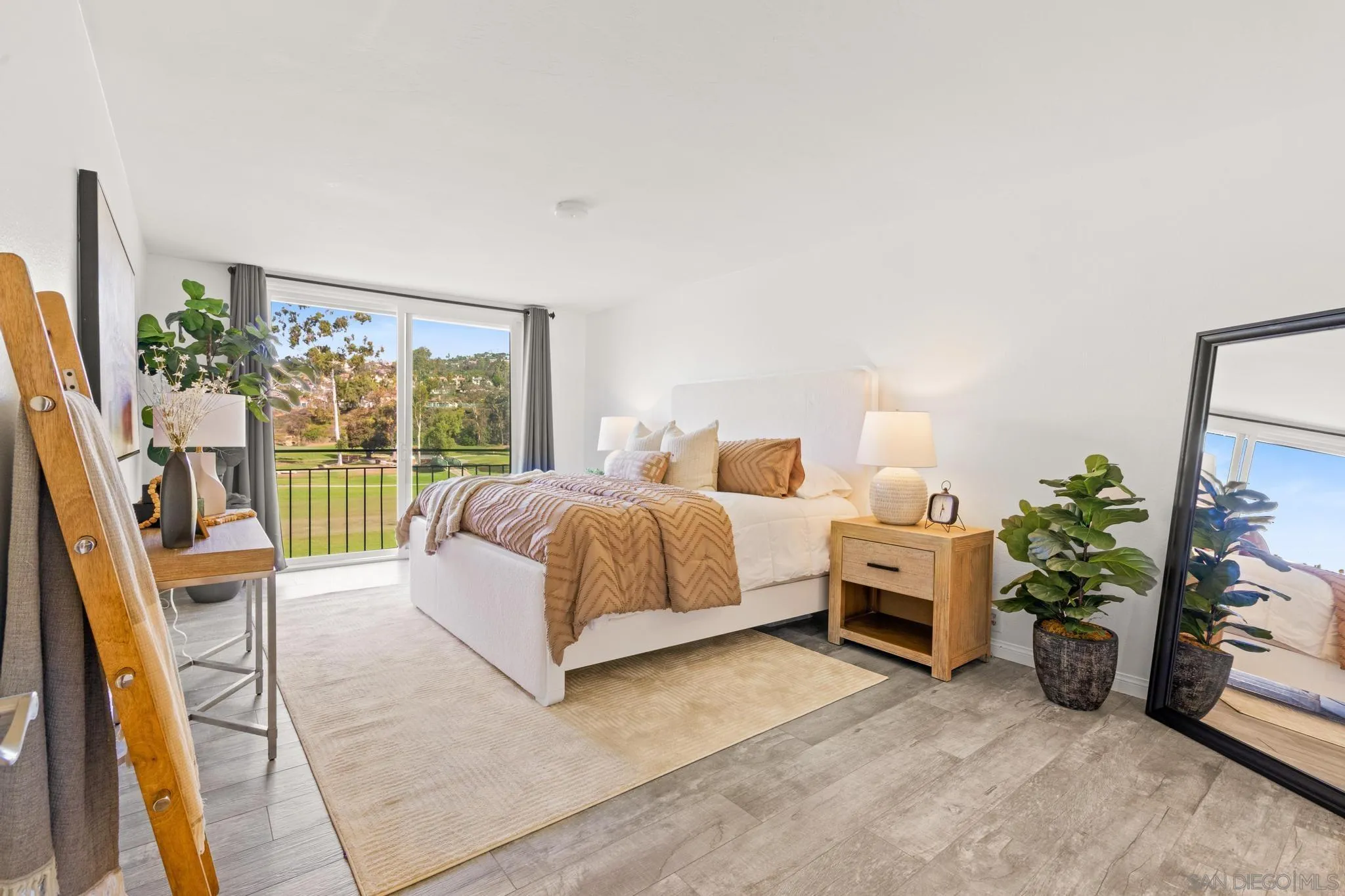 2544 Navarra Drive, Unit 17 Carlsbad, CA 92009 - Photo 7 of 24 a spacious bedroom with a bed and a window