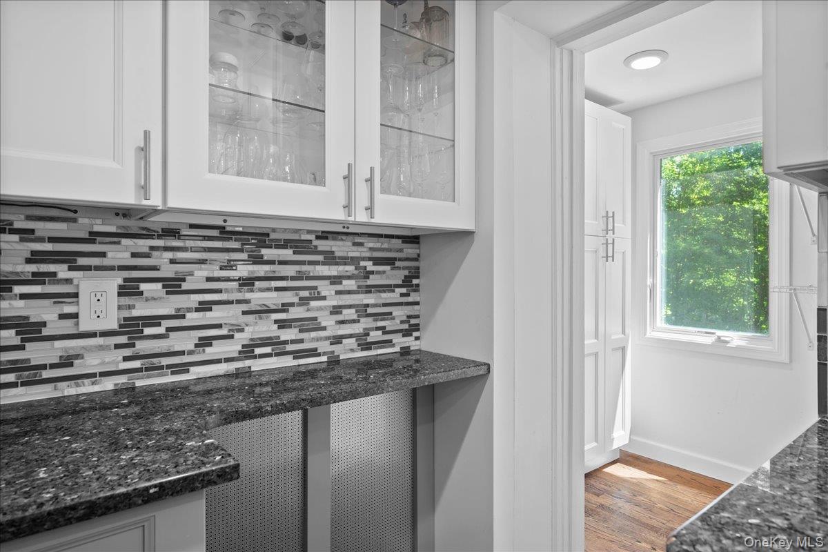 105 High St Extension Mount Kisco, NY 10549 - Photo 23 of 38 a bathroom with a granite countertop sink and a window