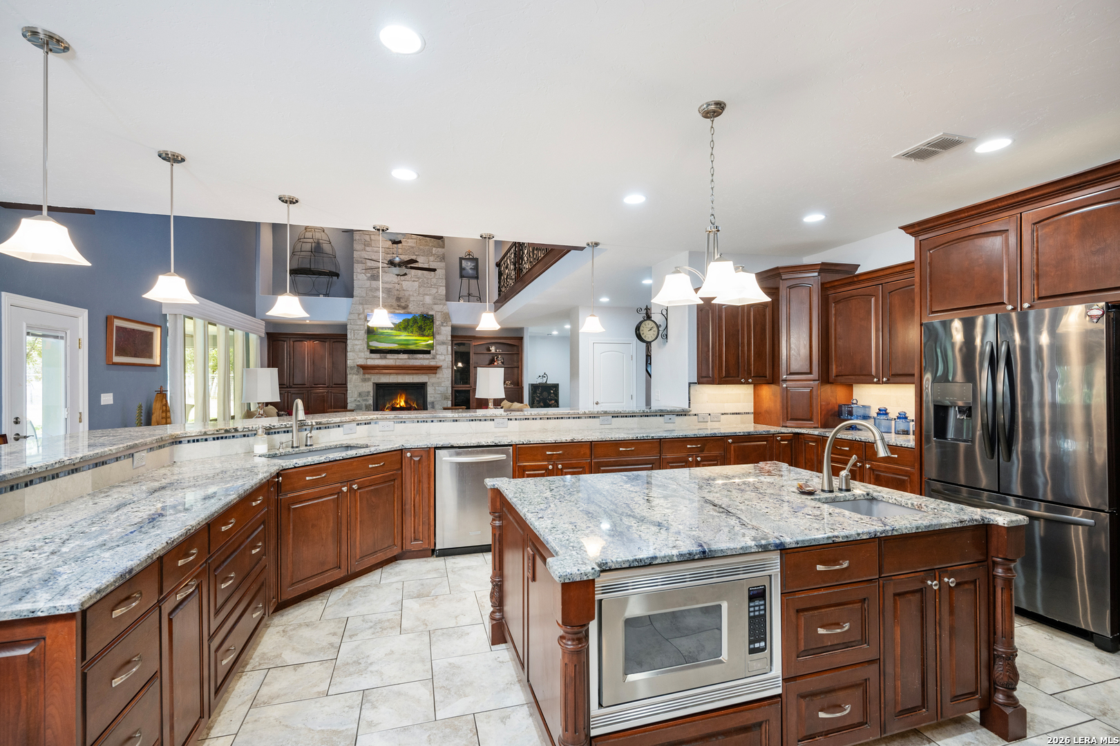 613 Saxet Trail Spring Branch, TX 78070 - Photo 11 of 50 a kitchen with center island and stainless steel appliances